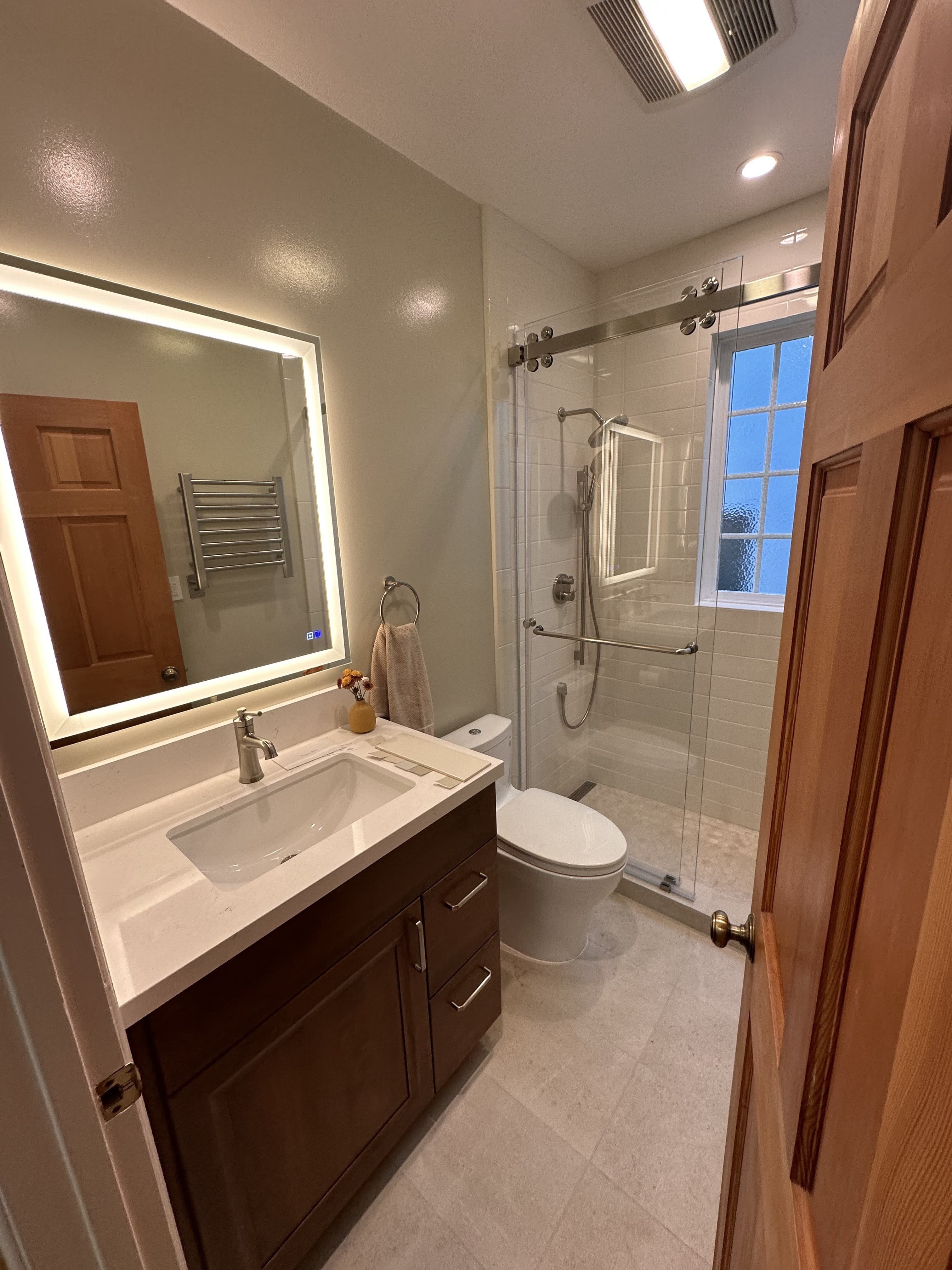 Bathroom renovation with glass shower and smart mirror – Bay Area