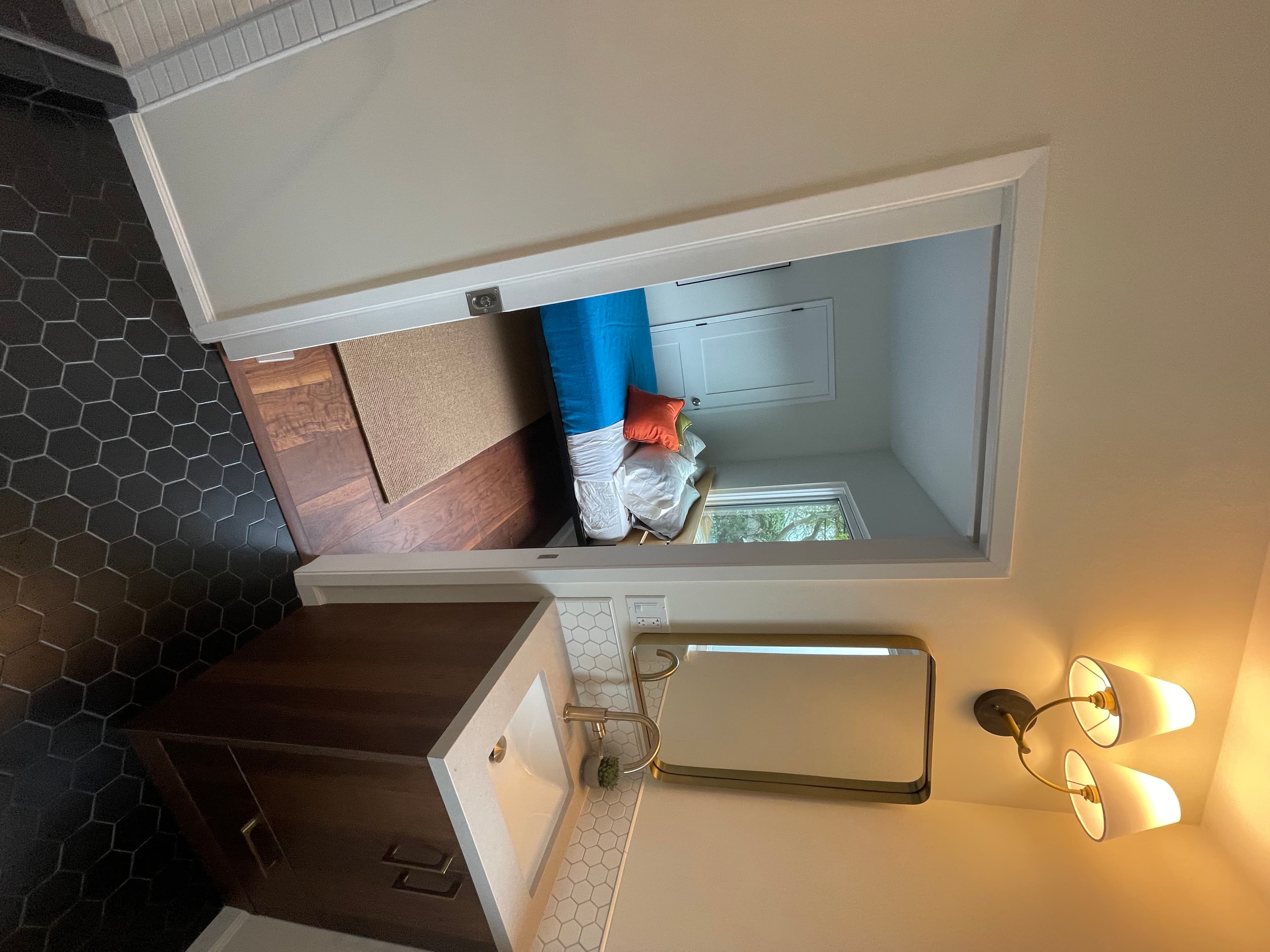 Bathroom remodel with custom vanity and gold mirror – Bay Area